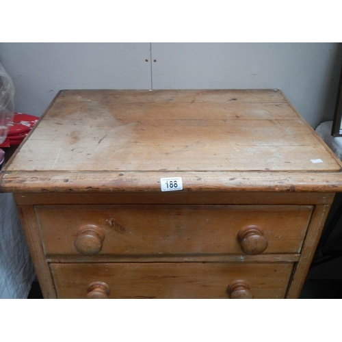 188 - An antique 3 drawer pine chest on bun feet, 33'' tall x 25'' wide