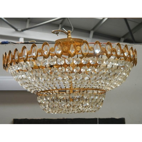 193 - A good quality brass and glass chandelier, 24'' diameter x 15'' drop.