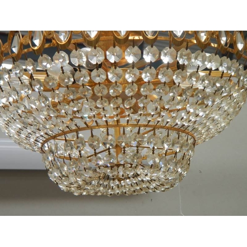 193 - A good quality brass and glass chandelier, 24'' diameter x 15'' drop.