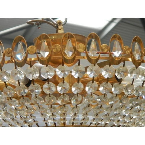 193 - A good quality brass and glass chandelier, 24'' diameter x 15'' drop.