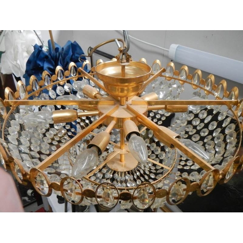 193 - A good quality brass and glass chandelier, 24'' diameter x 15'' drop.