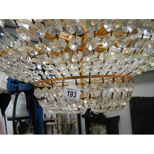 193 - A good quality brass and glass chandelier, 24'' diameter x 15'' drop.