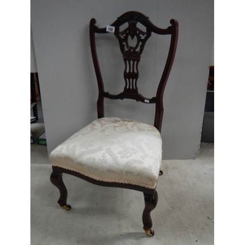 198 - An Edwardian bedroom chair on brass casters, in good condition,