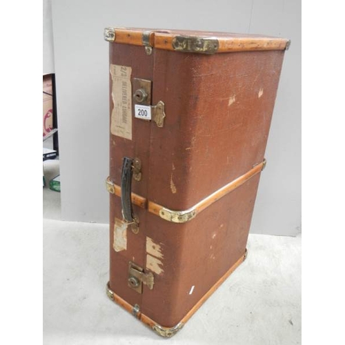 200 - A wooden bound travel trunk in good condition