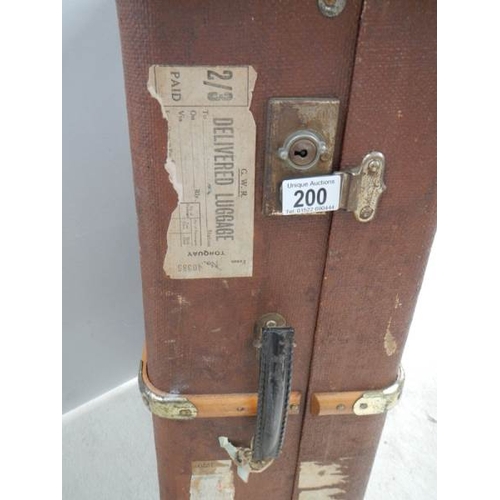 200 - A wooden bound travel trunk in good condition