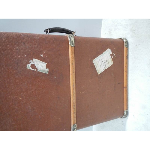 200 - A wooden bound travel trunk in good condition