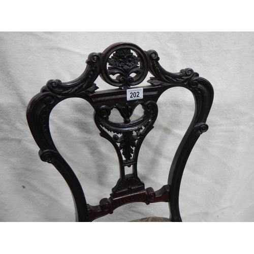 202 - A Victorian carved nursing chair,