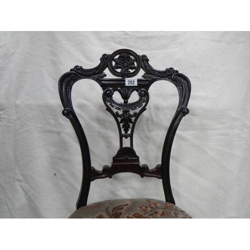 202 - A Victorian carved nursing chair,