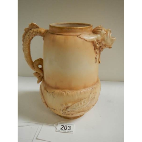 203 - An early Austrian jug with embossed fish decoration and gargoyle spout, maker W. R.