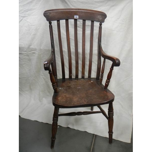 206 - A Victorian slat back Windsor arm chair.