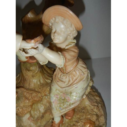 211 - A Tall royal Worcester figure as a candelabra, in perfect condition.