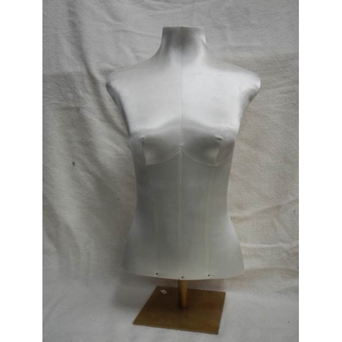 224 - An old shop display bust covered in silk and on metal base, 28'' tall.