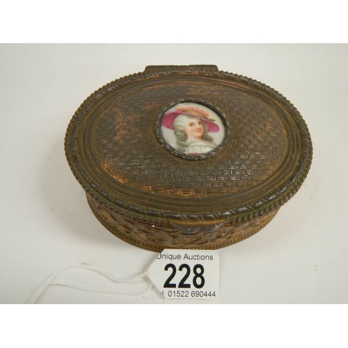 228 - A Victorian French oval metal box with hand painted plaque, 5'' wide.