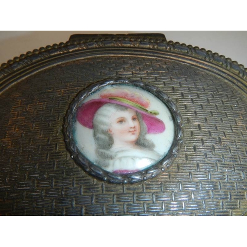 228 - A Victorian French oval metal box with hand painted plaque, 5'' wide.