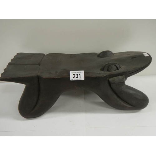 231 - An old Chinese wooden stool, 17'' long x 6'' high.