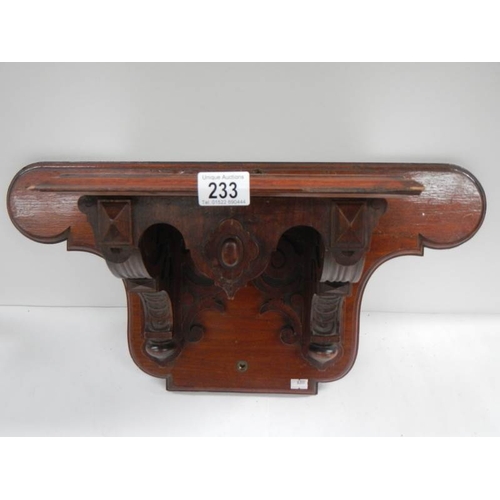 233 - A Victorian mahogany clock bracket, 23'' wide x 11.5'' high.