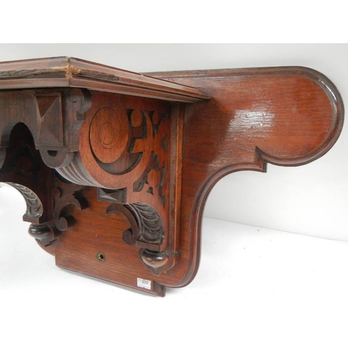 233 - A Victorian mahogany clock bracket, 23'' wide x 11.5'' high.