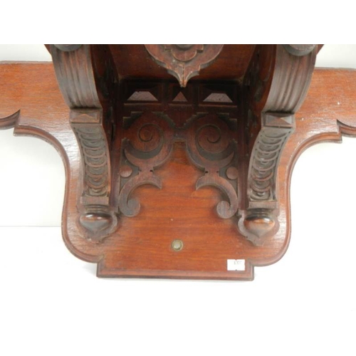 233 - A Victorian mahogany clock bracket, 23'' wide x 11.5'' high.