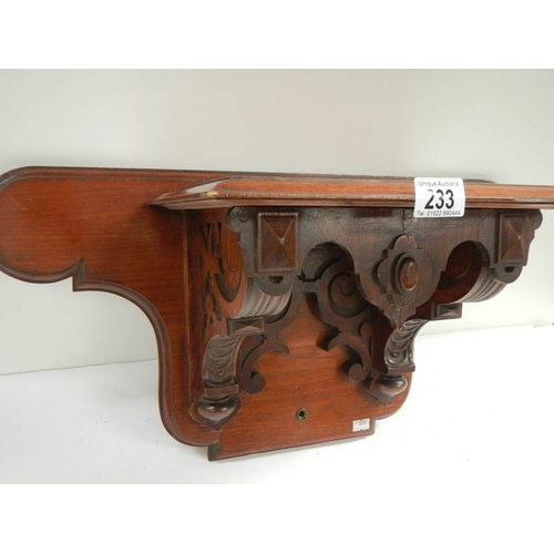 233 - A Victorian mahogany clock bracket, 23'' wide x 11.5'' high.