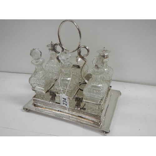 234 - A good Victorian 6 bottle cruet with cut glass bottles.