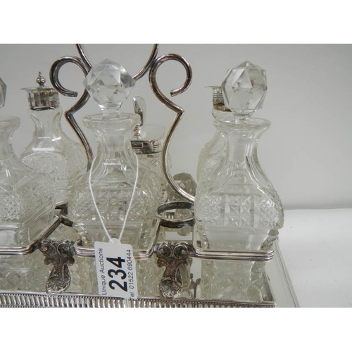 234 - A good Victorian 6 bottle cruet with cut glass bottles.