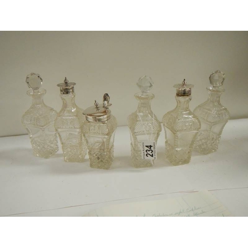 234 - A good Victorian 6 bottle cruet with cut glass bottles.