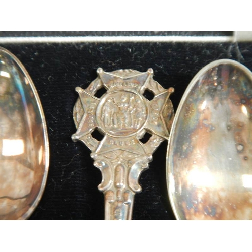 242 - A cased set of commemorative spoons for the Miniature Rifle Society.