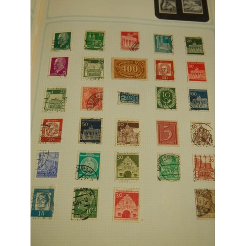 248 - A collection of postage stamps in 4 albums.