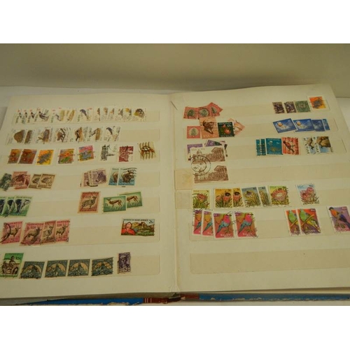 248 - A collection of postage stamps in 4 albums.