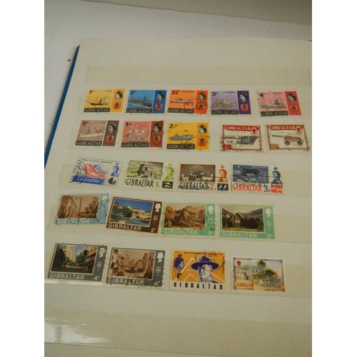 248 - A collection of postage stamps in 4 albums.