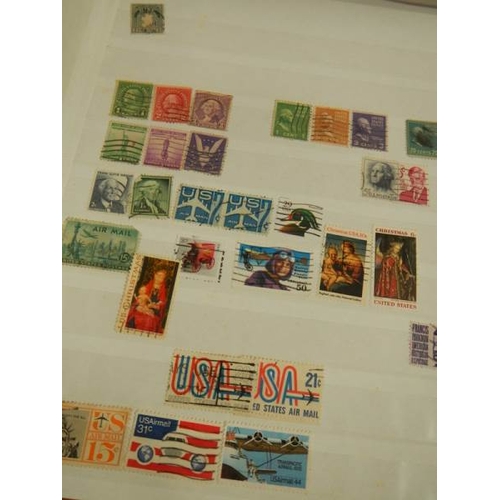 248 - A collection of postage stamps in 4 albums.