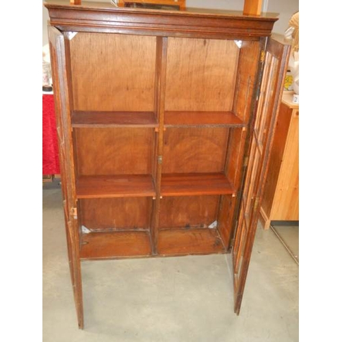 252 - A good oak 2 door bookcase,  high, in good condition.