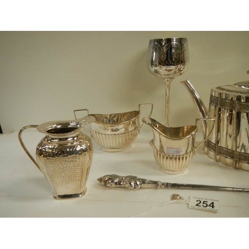 254 - 8 items of good 20th century silver plate and a silver handled button hook.