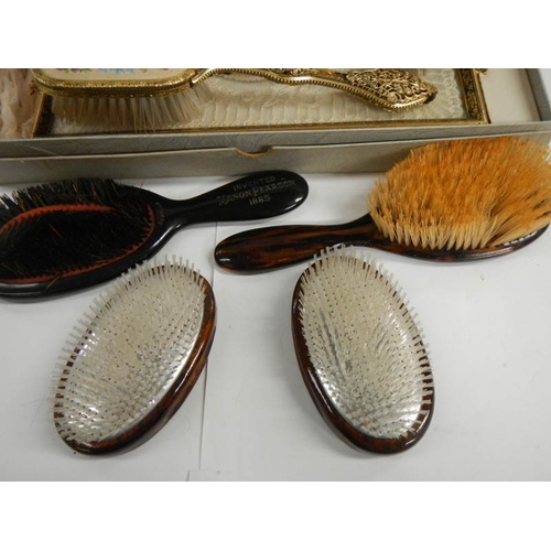 256 - An oak serving tray, a dressing table set (unused), and advertising brush and one other etc.,