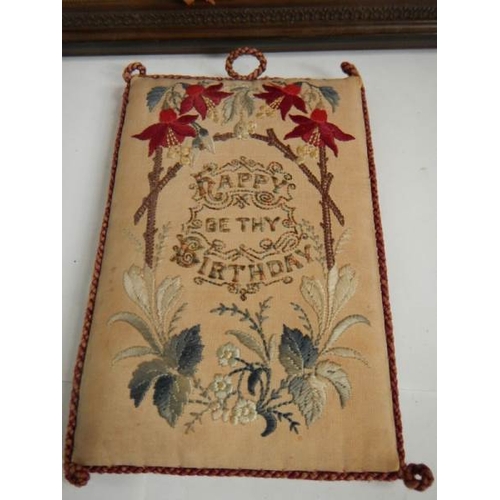 257 - An excellent embroidered panel with religious text and a pincushion (happy birthday).