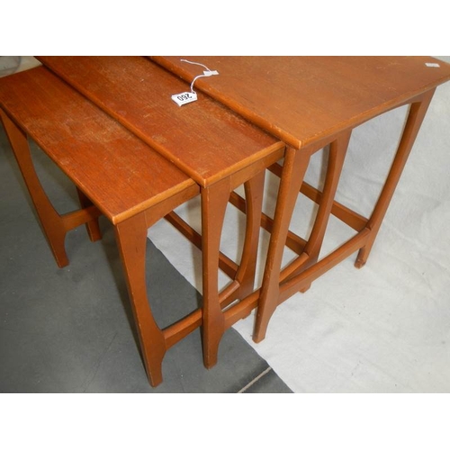 260 - A nest of 3 teak tables.