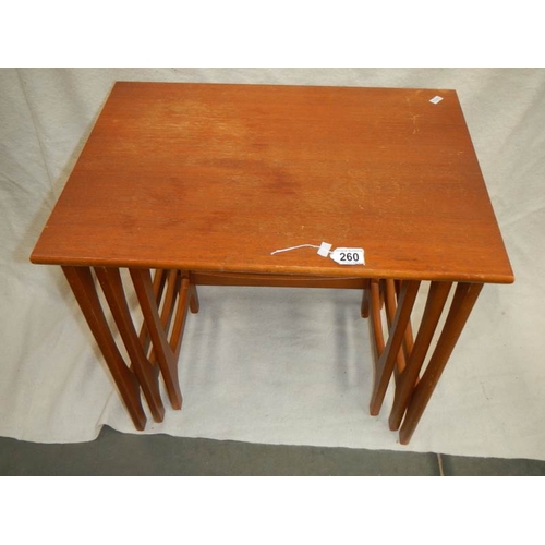 260 - A nest of 3 teak tables.