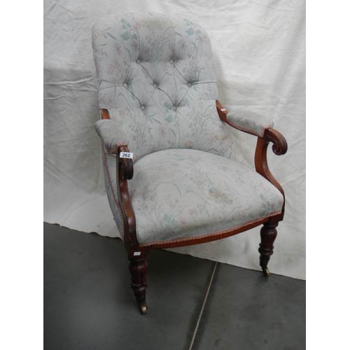 262 - A Victorian mahogany arm chair, upholstery in good condition for age.