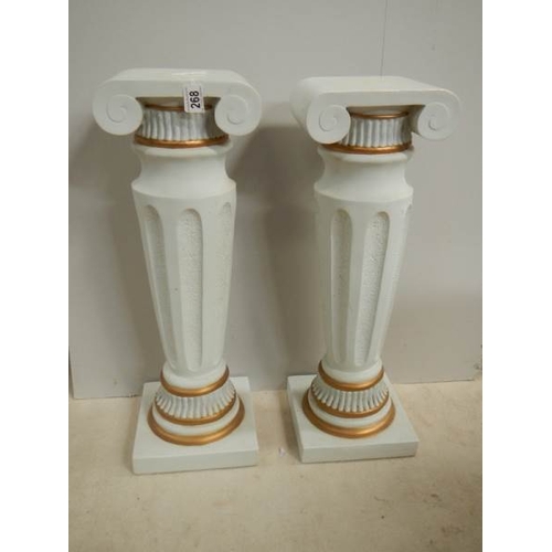 268 - A pair of matching pillars, 25.5'' tall, in good condition.