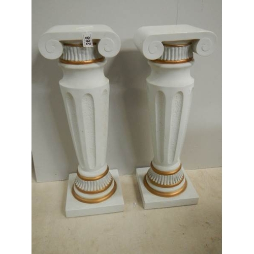 268 - A pair of matching pillars, 25.5'' tall, in good condition.