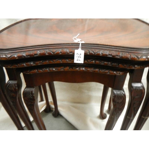 284 - A nest of 3 mahogany tables on cabriole legs.