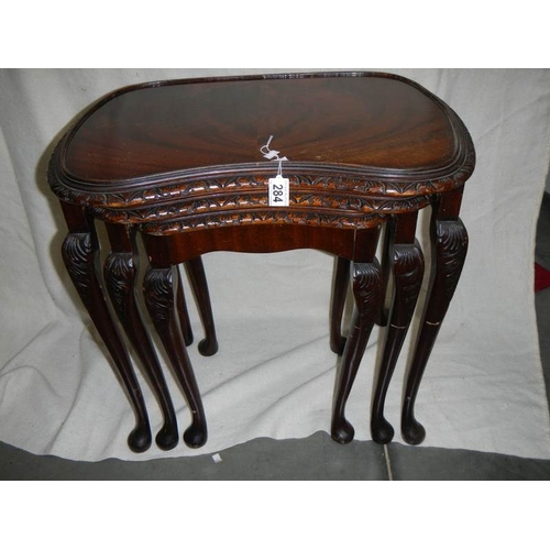 284 - A nest of 3 mahogany tables on cabriole legs.