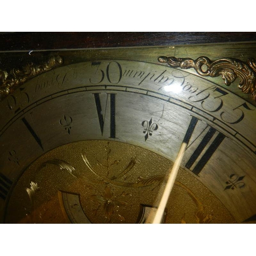 294 - A heavily carved 8 day brass faced Grandfather clock by Geo. Raphams, Brigg.