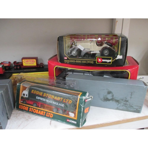 673 - A quantity of boxed Die cast including Corgi and Atlas Stobart lorries, Burago etc.