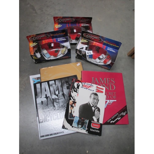 679 - A quantity of James Bond books & 3 x 007 Die cast cars