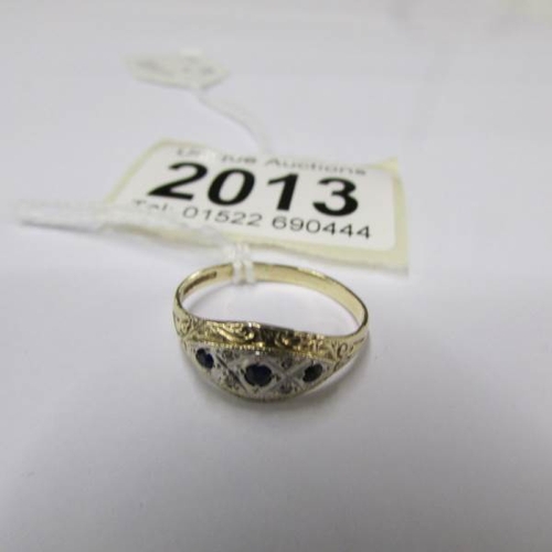 2013 - A yellow gold diamond and sapphire ring, size M.