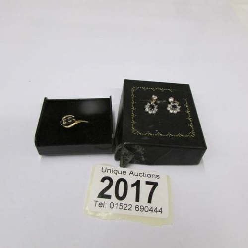 2017 - A 3 stone yellow gold sapphire ring, size J half and a pair of sapphire set earrings.