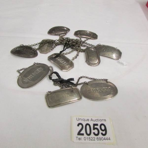 2059 - 10 silver drink / spirit decanter labels including brandy, Madeira, claret, etc.