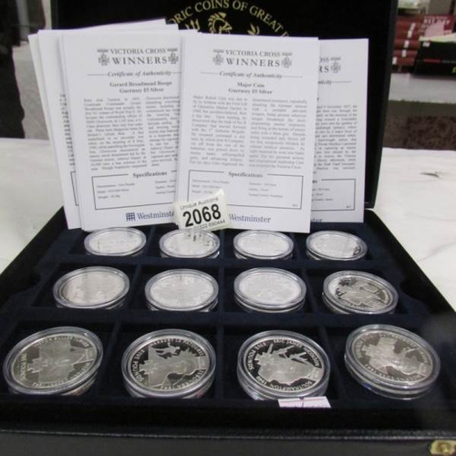 2068 - 18 cased mint silver £5 coins 'Victoria Cross Winners'.