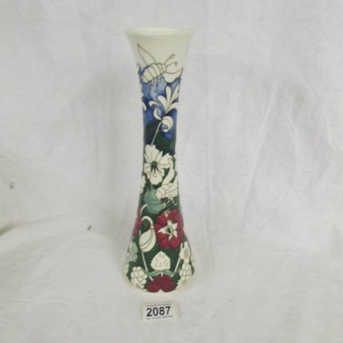 2087 - A Moorcroft polenator vase, approximately 30 cm tall, (second quality).